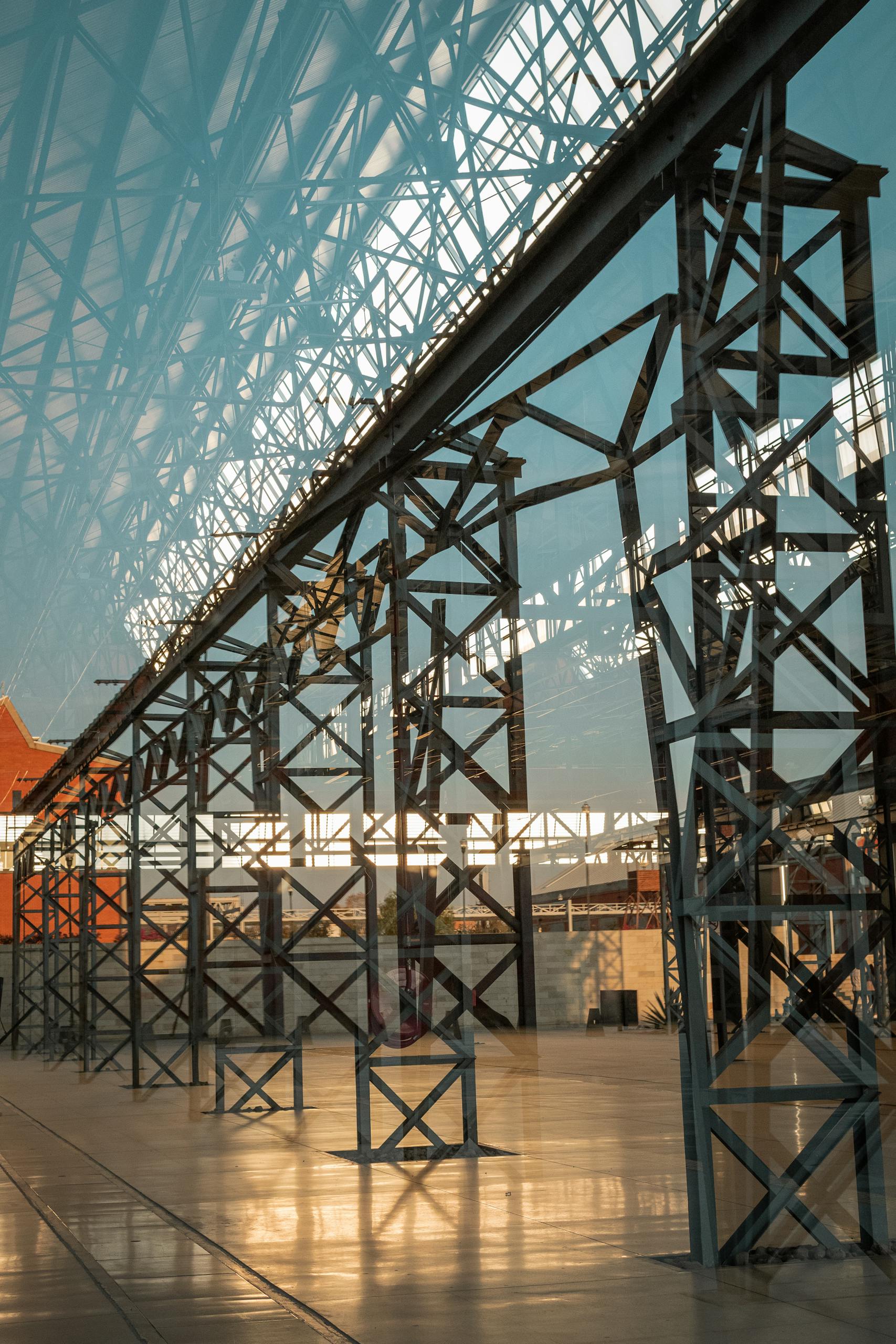A steel framework with glass reflections creating a modern architectural vibe.
